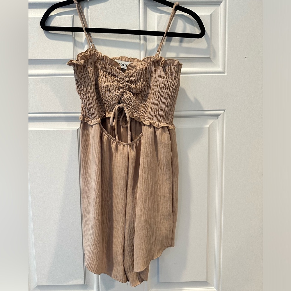 Beige boutique romper with adjustable shoulder straps